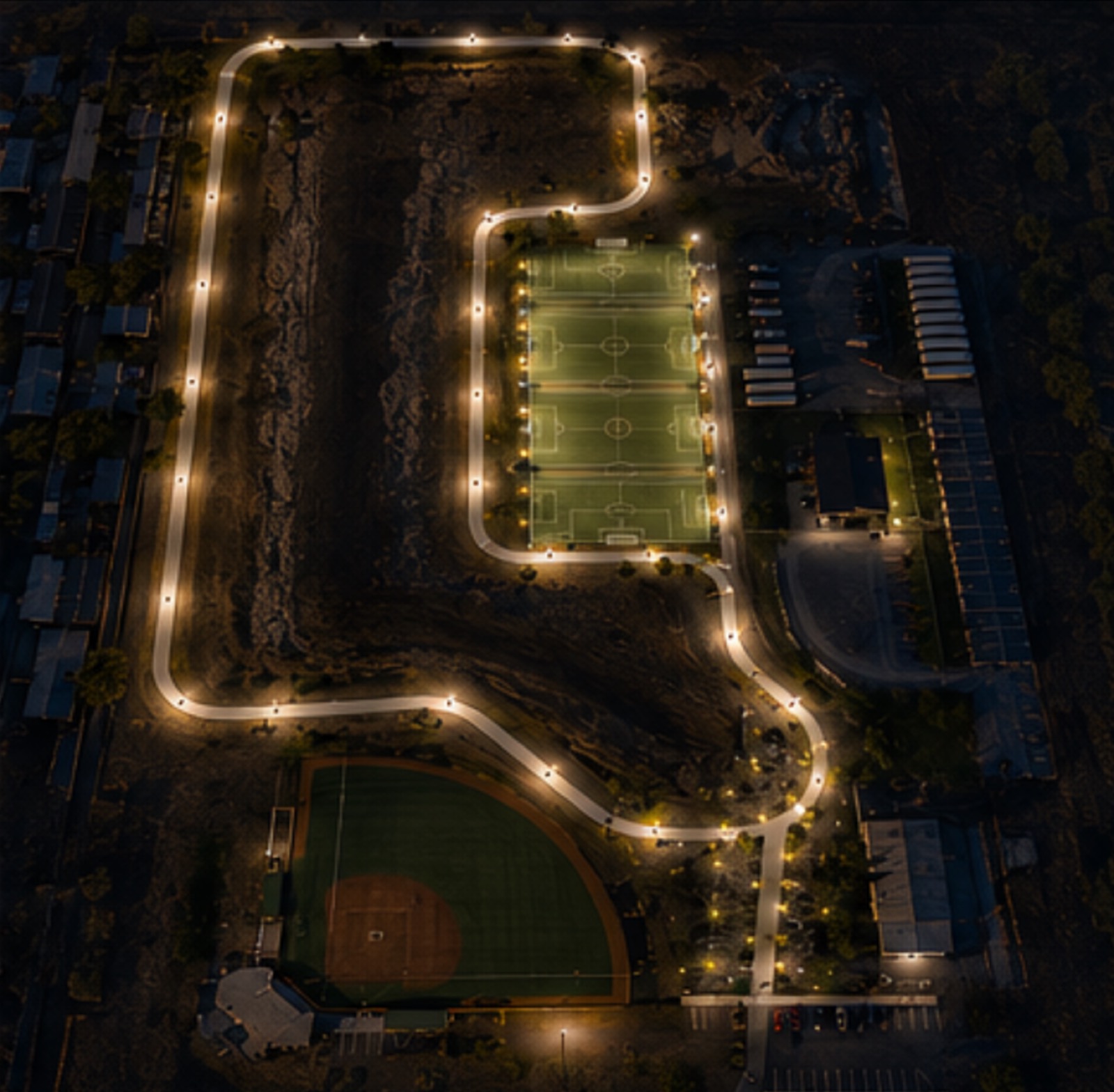 Night rendering of the Pacific Trails loop with the trail and fields lit